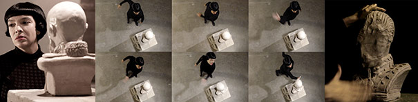 Eight dim, almost black-and-white, images. The first features a white woman with very straight black hair in a bob cut. She looks to the left with a sculptural bust on a pedestal in the foreground. The next images show her in action in a dark space with the bust. Lastly, a darkened image of the sculptural bust, with hands reaching towards it.