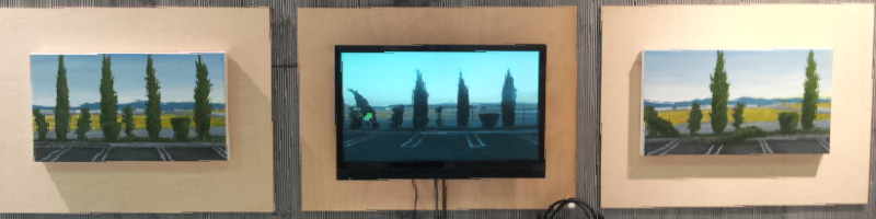 Three views of the same landscape scene rendered three times from left to right. Four tall cypress trees divide the rectangular space of a canvas and a monitor. A monitor showing a video of that landscape is flanked by two paintings of the same.