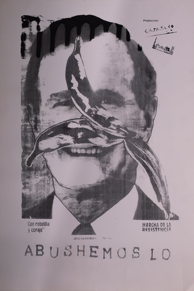 The black-and-white smiling face of a man is in the center of a page, who appears to be George H. W. Bush Sr., with a banana peel over part of his face. The text ABUSHEMOSLO is at the bottom.