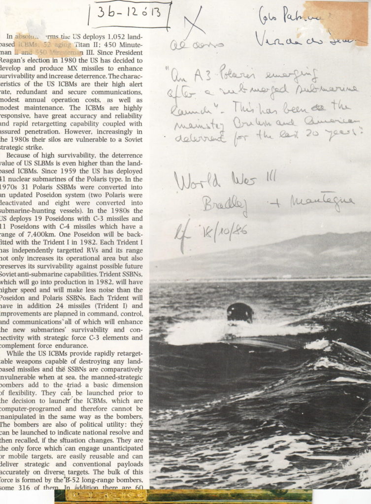 An image of page from a book with a column of text on the left third of the page and a black and white photo of a submarine or other sea faring vehicle in rough seas on the right. There are several splotches of pale pink in the upper left and right corners and some hand written text over the photo which in part reads "World War III" and 18/10/86.