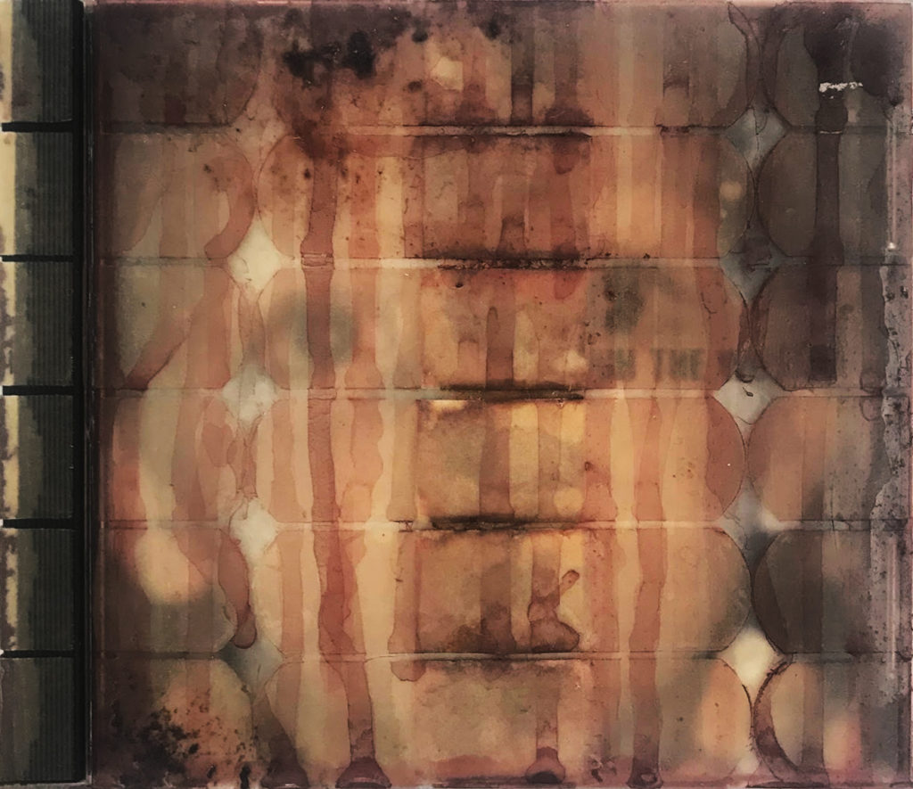 An abstract image used as a CD case cover, with rust and peach colored vertical stripes that are interupted by a central column of horizontal lines. These, as well as a strong vertical at the left and round forms at the right, are a dark brown/black.