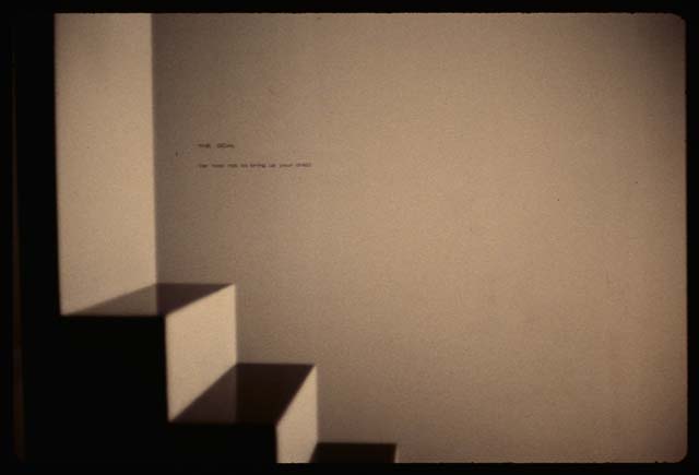 A photograph of a set of stairs that lead to a wall.