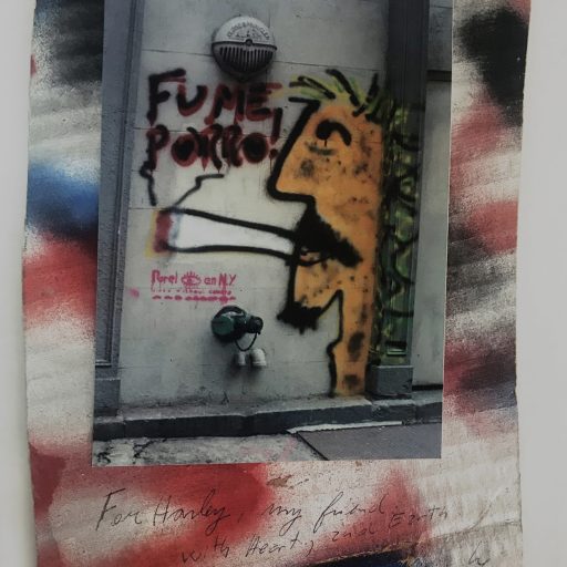 A poster on white paper covered in squiggles of red, black, and blue spray paint. At the center is a vertical rectangular photo of street graffiti featuring a man in profile on the right smoking an enormous cigarette. The works FUME PORRO are written above the cigarette.